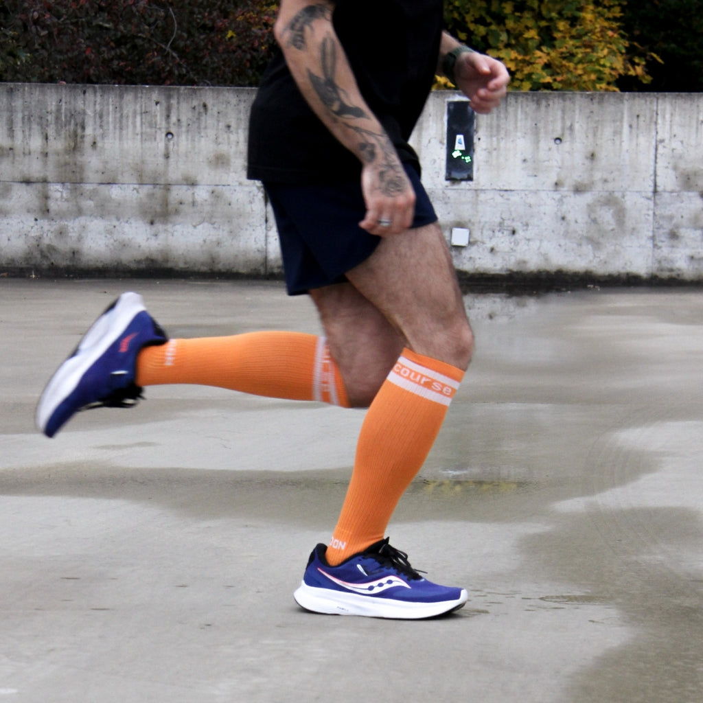 Spiridon chaussettes hautes de compression recyclé running orange free to run